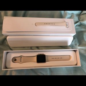 Apple Watch with extra bands and charging stand